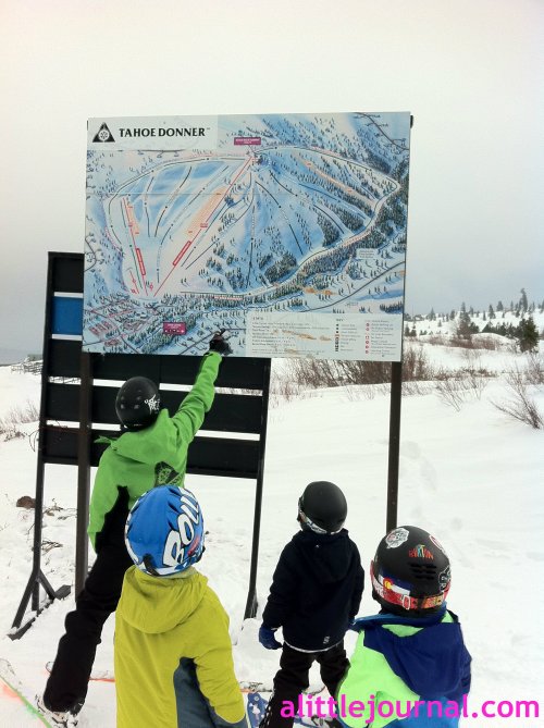 The kids checking the ski map to prepare for their first green run, the mile run (yup, it's a mile). They had just come up on their first chair lift. So many fun firsts.